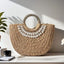 Seashell-Embellished Woven Straw Handbag