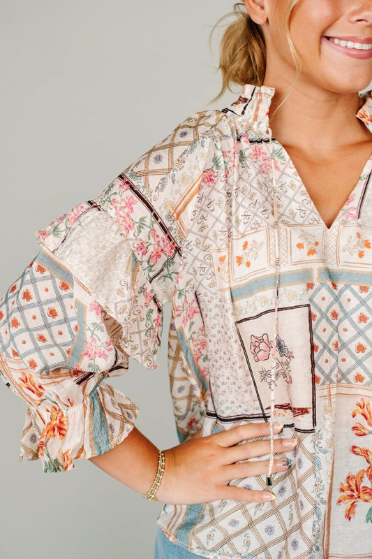 Ruffled Printed Tie Neck Three-Quarter Sleeve Blouse